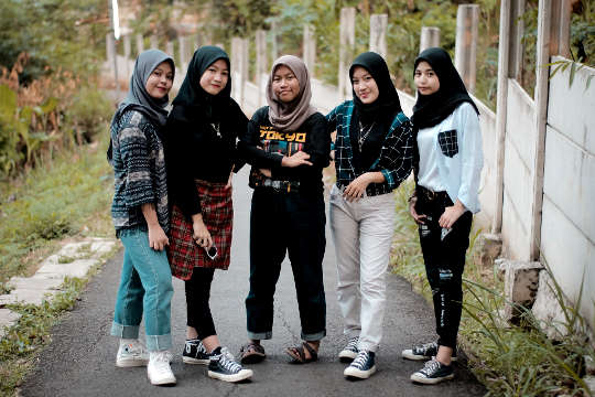 A 6-Step Path to Happiness and Civility five young women wearing hijabs and dressed in very modern clothing such as jeans